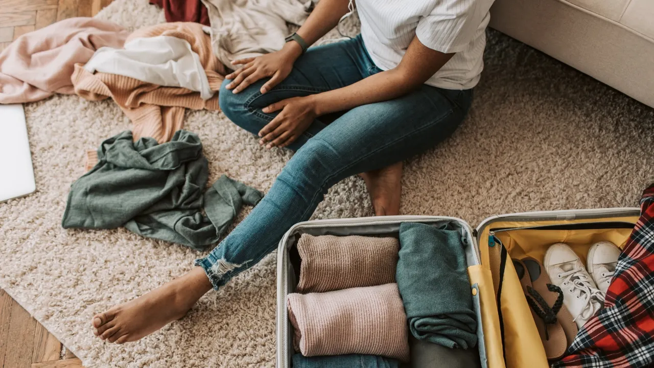 A Woman Packing Her Suitcase